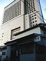 佐藤旅館と背後のホテル阪神の寫眞
